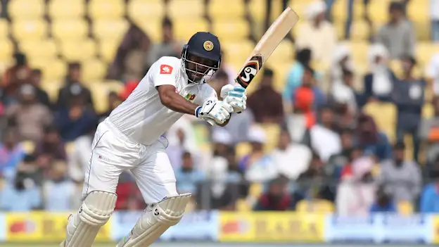 Dimuth Karunaratne scored a patient 147-ball 51 before being trapped leg before by Ishant Sharma.