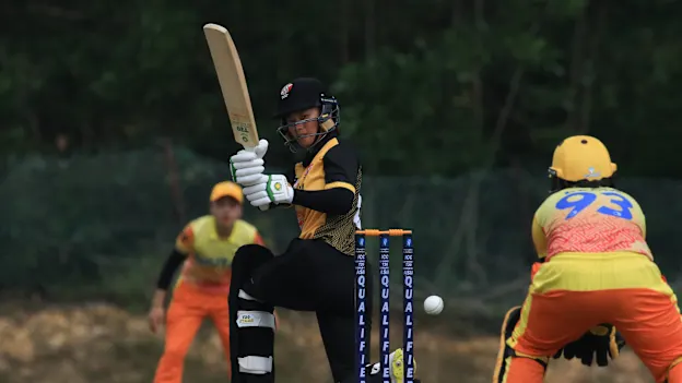 Elsa Hunter of Malaysia plays a shot 