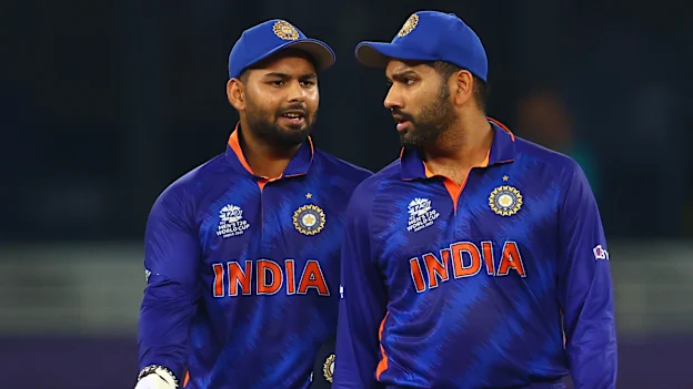 Rishabh Pant and Rohit Sharma of India interact during the ICC Men's T20 World Cup match between India and Pakistan 1920x1080