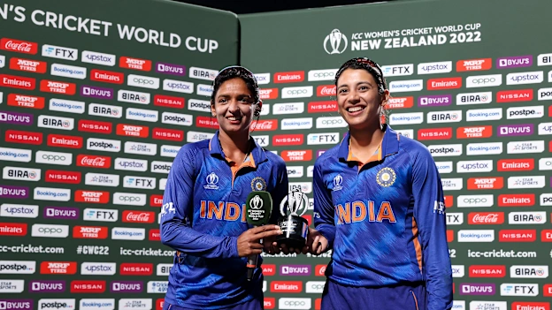 Harmanpreet Kaur (L) and Smriti Mandhana of India pose with the Player of the Match Award during the 2022 ICC Women's Cricket World Cup match between West Indies and India at Seddon Park on March 12, 2022 in Hamilton, New Zealand.