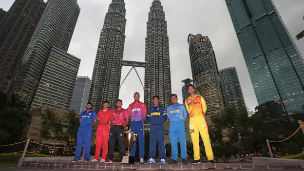 Team Captains with the trophy at the Petronas Twin Tower at the background