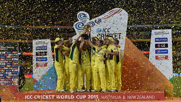 Australia's teammates celebrate with the trophy after victory against New Zealand during their 2015 Cricket World Cup final in Melbourne on March 29, 2015.
