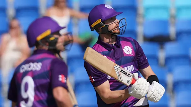 Scotland's Michael Jones (R) watches his shot over the boundary line for six runs during the ICC mens Twenty20 World Cup 2022 cricket match between Ireland and Scotland 1920x1080