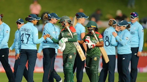 Players congratulate each other after the 2022 ICC Women's Cricket World Cup match between England and Bangladesh at Basin Reserve on March 27, 2022 in Wellington, New Zealand.
