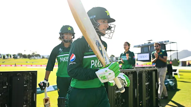 Bismah Maroof (R) and Diana Baig of Pakistan leaves the field at the end of the innings during the 2022 ICC Women's Cricket World Cup match between Australia and Pakistan at Bay Oval on March 08, 2022 in Tauranga, New Zealand.