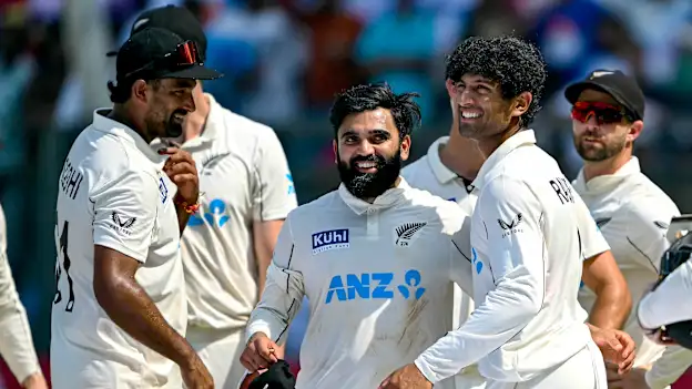 New Zealand's Ish Sodhi (L), Ajaz Patel (2L) and Rachin Ravindra (2R) celebrate after their team's win against India at the end of their third and final Test cricket match in the Wankhede Stadium of Mumbai