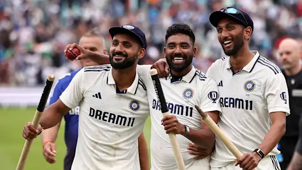 India's Akash Deep, Prasidh Krishna hold the stumps and Mohammed Siraj holds the match ball after taking 5 wickets after winning the final Test cricket match between England and India at The Oval