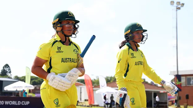 Kate Pelle and Sianna Ginger of Australia make their way out to bat during the ICC Women's U19 T20 World Cup 2023 Super 6 match between India and Australia at North-West University Oval on January 21, 2023 in Potchefstroom, South Africa.