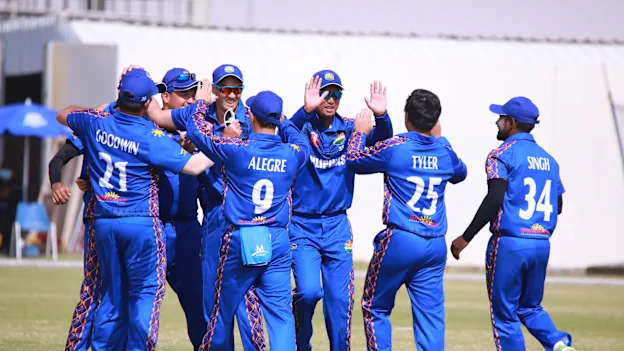 Philippines players celebrate after a wicket