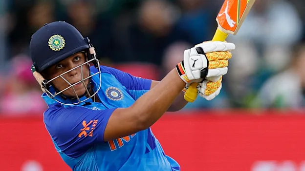 India's Richa Ghosh hits a six during the Group B T20 women's World Cup cricket match between England and India at St George's Park in Gqeberha on February 18, 2023.