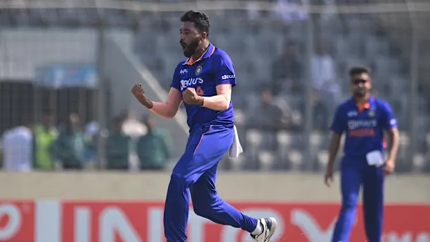 Mohammed Siraj (L) celebrates the wicket of Bangladesh's Anamul Haque (not pictured) during the second one-day international (ODI) cricket match between Bangladesh and India at the Sher-e-Bangla National Cricket Stadium in Dhaka on December 7, 2022.