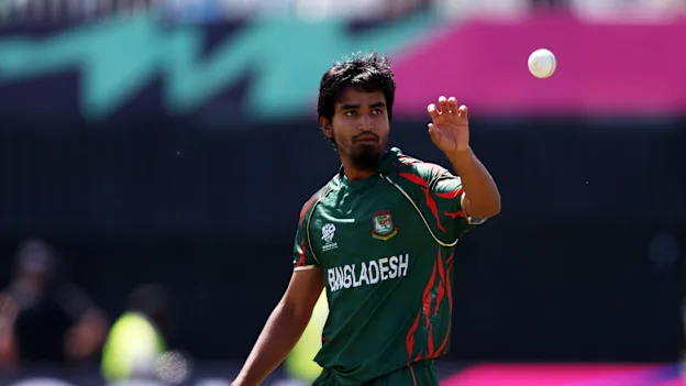 Tanzim Hasan Sakib of Bangladesh gathers the ball during the ICC Men's T20 Cricket World Cup West Indies & USA 2024 match between South Africa and Bangladesh at Nassau County International Cricket Stadium on June 10, 2024 in New York, New York.
