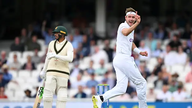 Stuart Broad celebrates after taking the wicket of Usman Khawaja