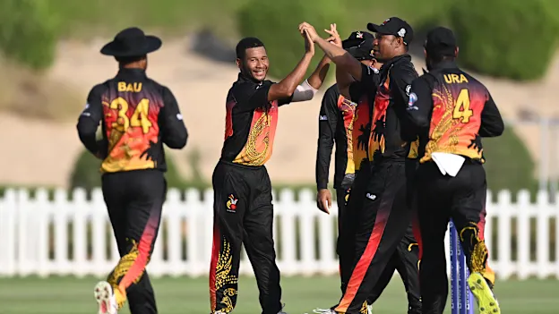 Papua New Guinea celebrate a wicket against Ireland.