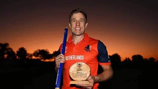 Logan van Beek of Netherlands pose for a photo while holding a match stump and the Player of the Match award after winning the ICC World Cup Qualifier Zimbabwe 2023 match between the West Indies and Netherlands at Takashinga Cricket Club on June 26, 2023.
