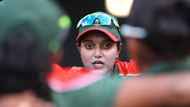 Bangladesh captain Nigar Sultana talks to her players before the 2022 ICC Women's Cricket World Cup match between India and Bangladesh at Seddon Park on March 22, 2022 in Hamilton, New Zealand.