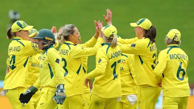Ashleigh Gardner (3L) of Australia celebrates with teammates