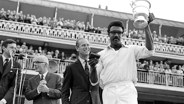 West Indies captain Clive Lloyd poses with the inaugural ICC Men's Cricket World Cup trophy