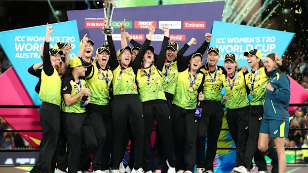 Meg Lanning of Australia and team mates celebrate with the ICC T20 Trophy after winning the ICC Women's T20 Cricket World Cup Final match between India and Australia at the Melbourne Cricket Ground on March 08, 2020 in Melbourne, Australia.