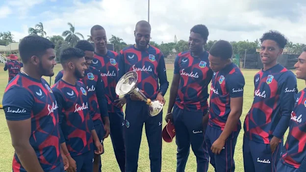 Curtly Ambrose holds U19 Men's CWC Trophy