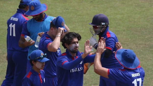 Mahsid Faheem celebrates with his teammates