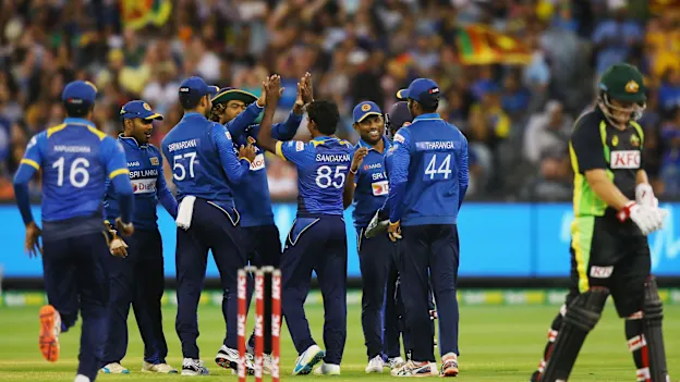 Sri Lankan players celebrate the wicket of Michael Klinger