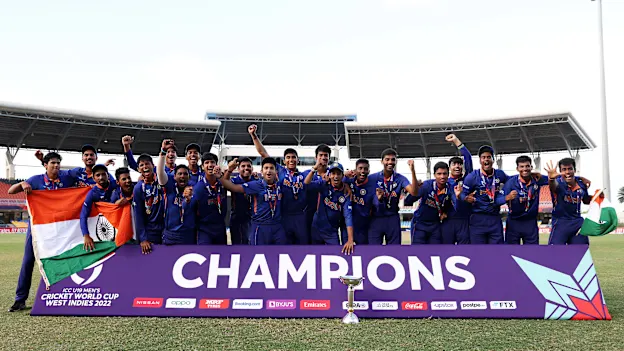 Players of India pose with the ICC U19 Men's World Cup Trophy following the ICC U19 Men's Cricket World Cup Final match between England and India at Sir Vivian Richards Stadium on February 05, 2022 in Antigua, Antigua and Barbuda.