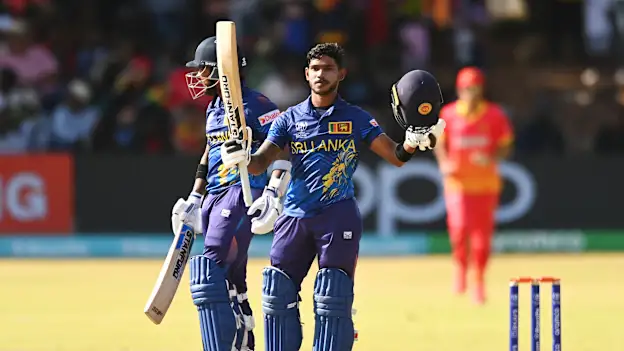 Pathum Nissanka of Sri Lanka celebrates scoring a century while leaving the field alongside teammate Kusal Mendis after winning the ICC Men's Cricket World Cup Qualifier Zimbabwe 2023 Super 6 match between Zimbabwe and Sri Lanka on July 02, 2023.