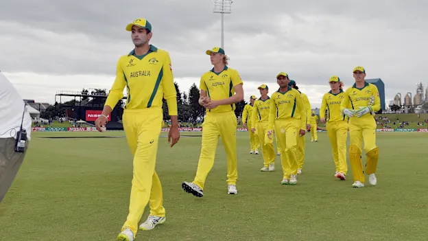 Jason Sangha and Australia's players leave the field