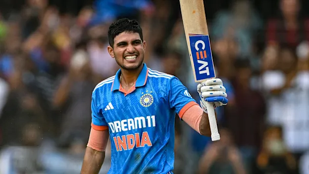 India's Shubman Gill celebrates after scoring a century (100 runs) during the second one-day international (ODI) cricket match between India and Australia