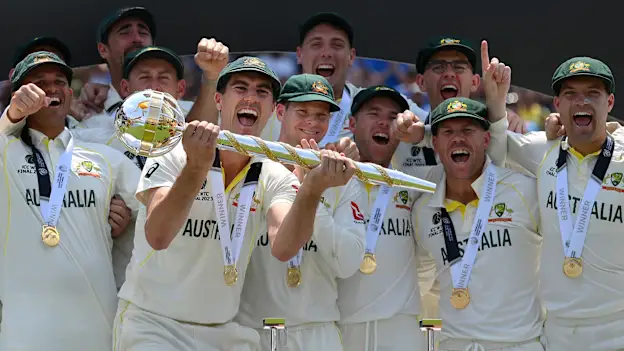 Pat Cummins of Australia lifts the ICC World Test Championship Mace on day five of the ICC World Test Championship Final between Australia and India
