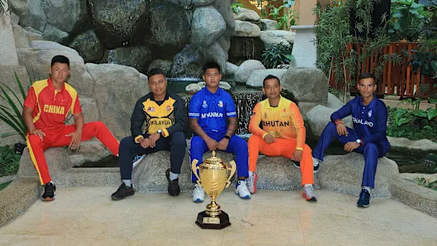 Captains pose with the trophy ahead of the ICC Men’s T20 World Cup Asia Qualifier B