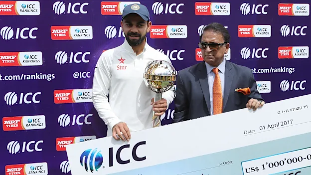 The Indian captain, Virat Kohli receives the mace and cheque  for one million dollars as his side finished No. 1 in the ICC Test rankings ahead of the April 1 cut-off date