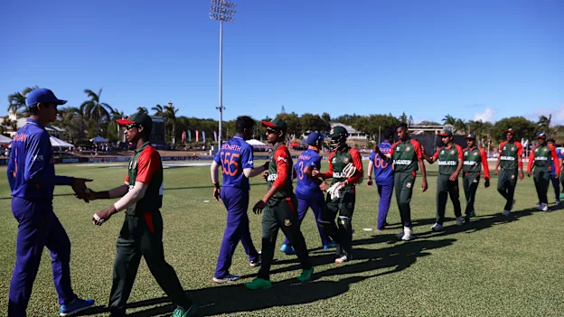 Players of Bangladesh and India interact following the ICC U19 Men's Cricket World Cup Super League Quarter Final 2 match between India and Bangladesh at Coolidge Cricket Ground.