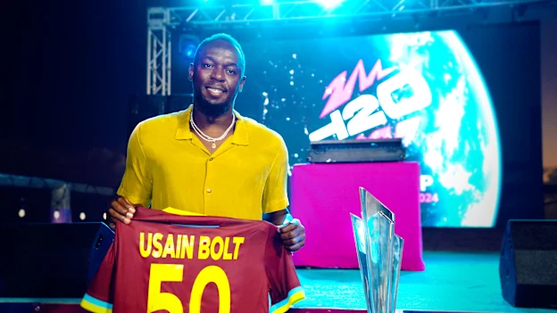 Usain Bolt with the ICC Men's T20 World Cup trophy