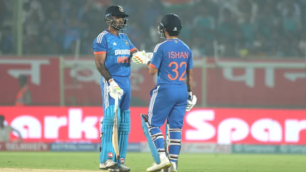 India's Ishan Kishan and India's captain Suryakumar Yadav interact during game one of the T20 International Series