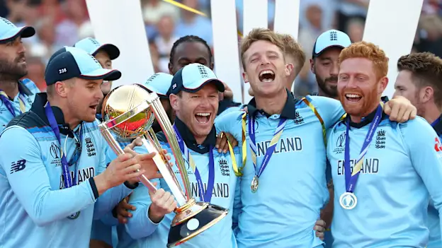 England Captain Eoin Morgan lifts the World Cup with the England team after victory for England during the Final of the ICC Cricket World Cup 2019 between New Zealand and England at Lord's Cricket Ground on July 14, 2019 in London, England.