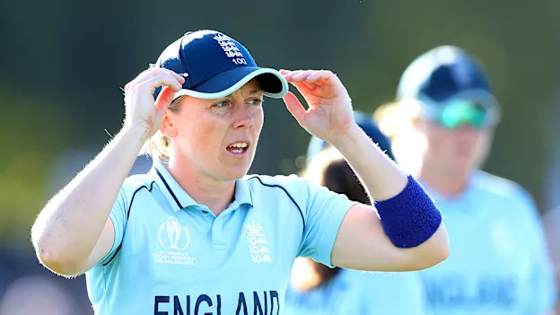 Heather Knight of England leads the team off the field at the end of the first inning during the 2022 ICC Women's Cricket World Cup Final match between Australia and England at Hagley Oval on April 03, 2022 in Christchurch, New Zealand.
