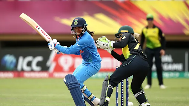 Smriti Mandhana of India bats with Alyssa Healy of Australia looking on during the ICC Women's World T20 2018 match between India and Australia at Guyana National Stadium on November 17, 2018 in Providence, Guyana.