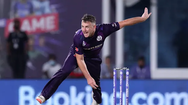 Scotland's Chris Greaves bowls during the ICC mens Twenty20 World Cup cricket match between Bangladesh and Scotland at the Oman Cricket Academy Ground in Muscat on October 17, 2021.