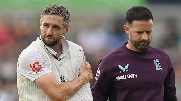 Chris Woakes walks off the field