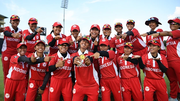 Ni Luh Ketut Dewi of Indonesia poses with the Player of the Match Award alongside their team mates following the ICC Women's U19 T20 World Cup 2023 4th place playoff match between Zimbabwe and USA at Willowmoore Park on January 20, 2023.