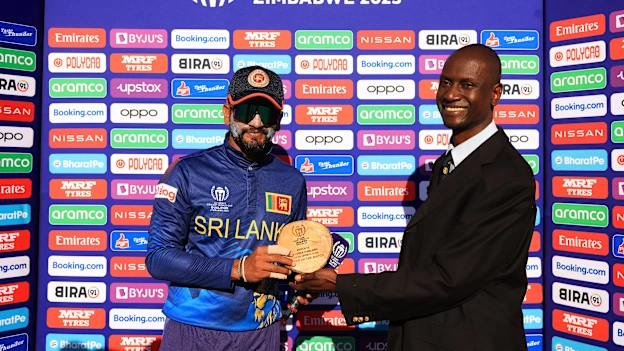Dimuth Karunarathana of Sri Lanka poses for a photo with the Player of the Match award.