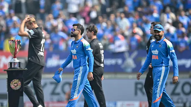 India's Virat Kohli (L) and Rohit Sharma (R) arrive for the national anthem before the start of the first one-day international