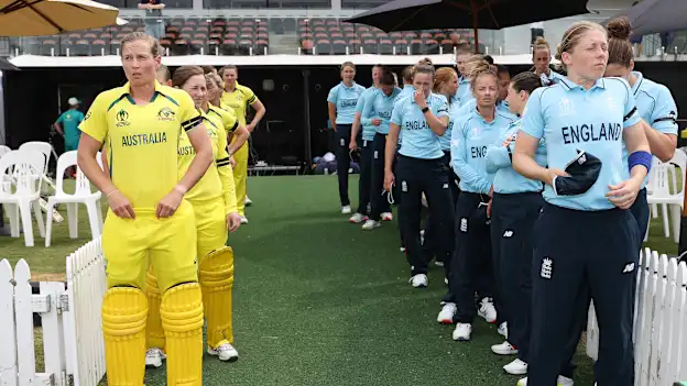 Meg Lanning of Australia and Heather Knight of England prepare to lead their sides out to the field of play for the 2022 ICC Women's Cricket World Cup match between Australia and England at Seddon Park on March 05, 2022 in Hamilton, New Zealand.