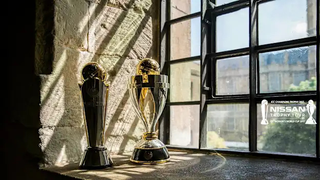 The ICC Champions Trophy and ICC Women's World Cup Trophy on display at the Nissan Trophy Tour in London