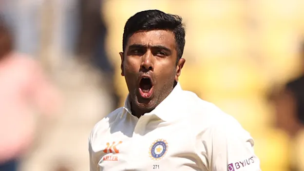 Ravichandran Ashwin of India celebrates taking the wicket of David Warner of Australia during day three of the First Test match in the series between India and Australia 1920x1080