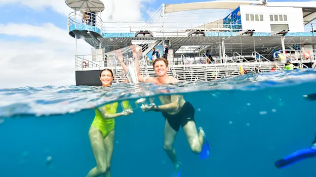 Adam Zampa & Erin Holland take the trophy for a swim on the reef