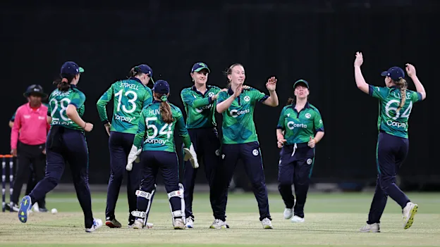 Orla Prendergast of Ireland celebrates with teammates after taking the wicket of Sterre Kalis of the Netherlands.