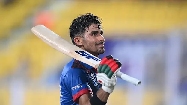 Rahmanullah Gurbaz of Afghanistan acknowledges the crowd during the ICC Men's Cricket World Cup India 2023 warm up match between Afghanistan and Sri Lanka at Barsapara Cricket Stadium on October 03, 2023 in Guwahati, India.